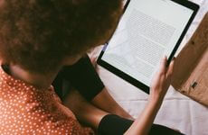 Woman reading blog on tablet